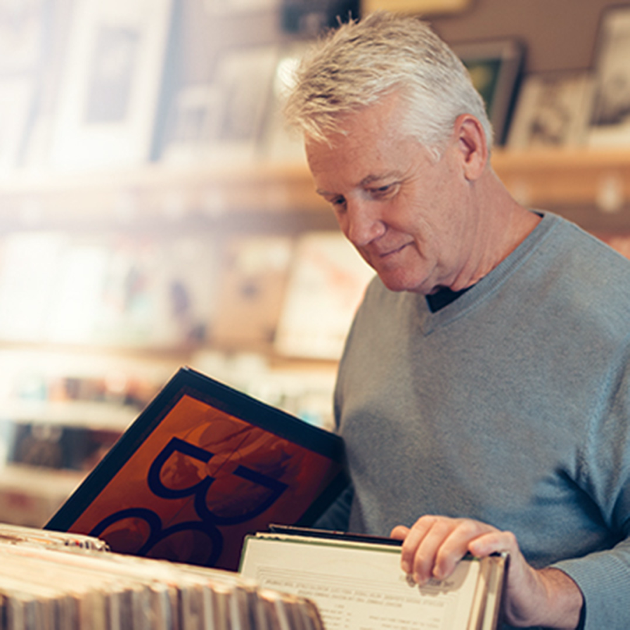 man looking at vinyl records